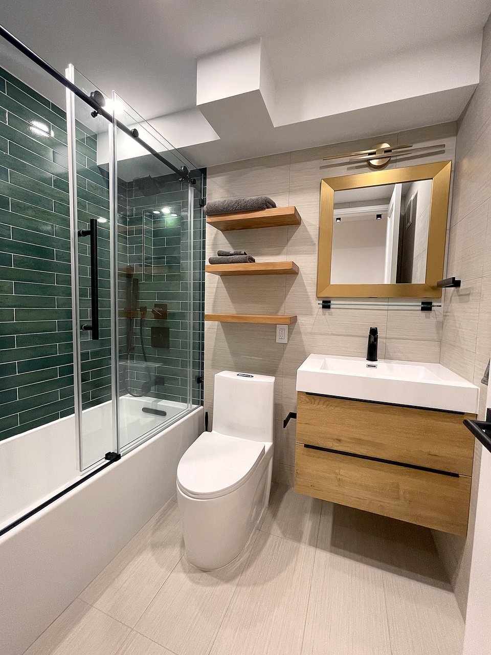 Green tile, wood shelf and warm metal detail