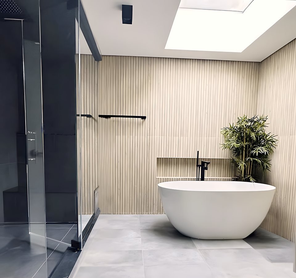 Freestanding tub with backlit mirror and layered lighting
