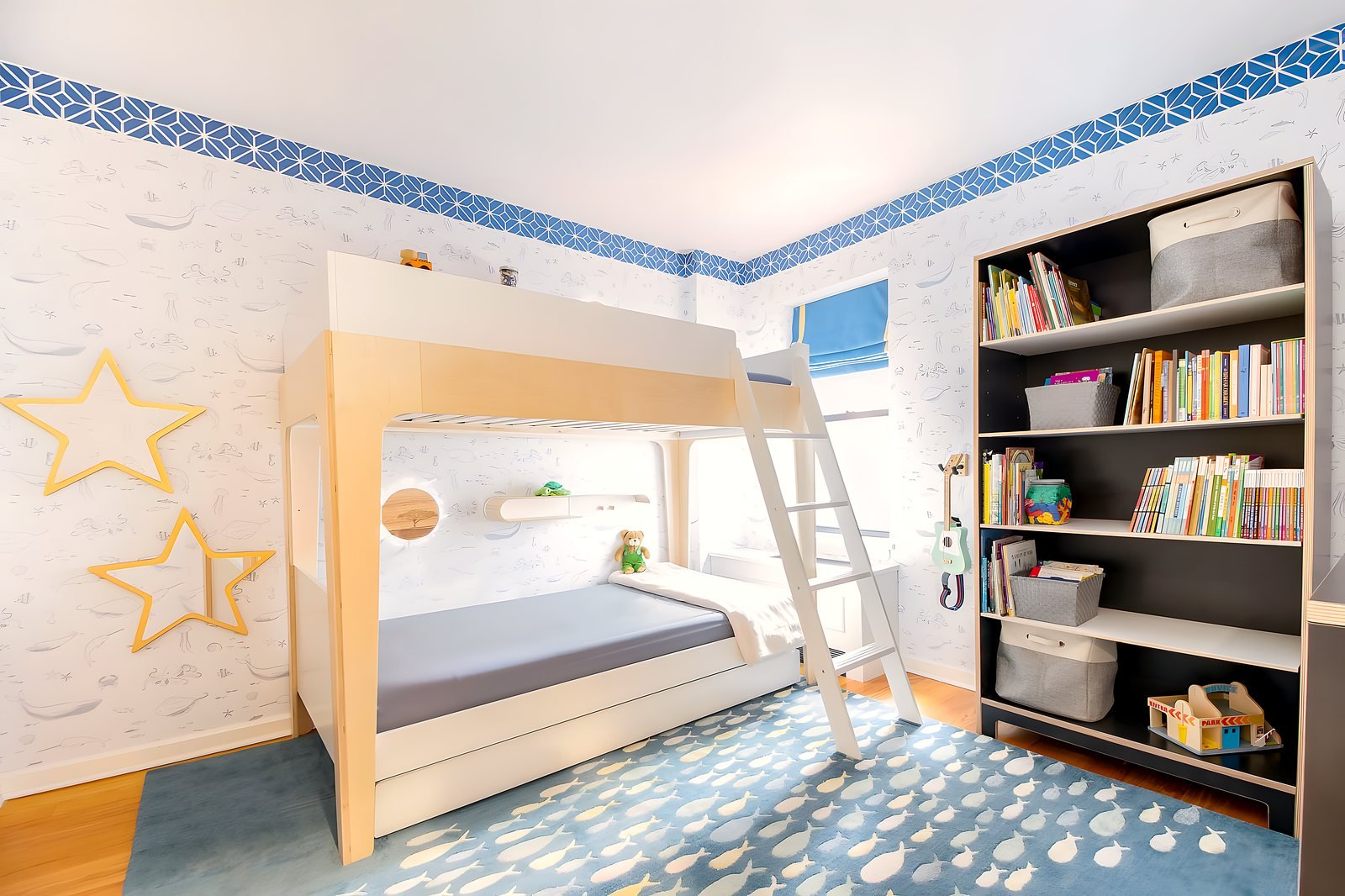 Boys' bedroom in a Park Slope brownstone with a custom bed and characterful wallpaper