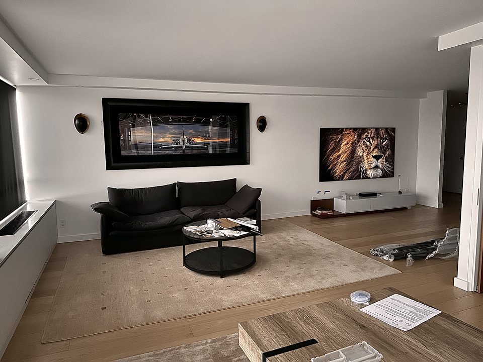 Concealed bar nook with backlit glass shelving