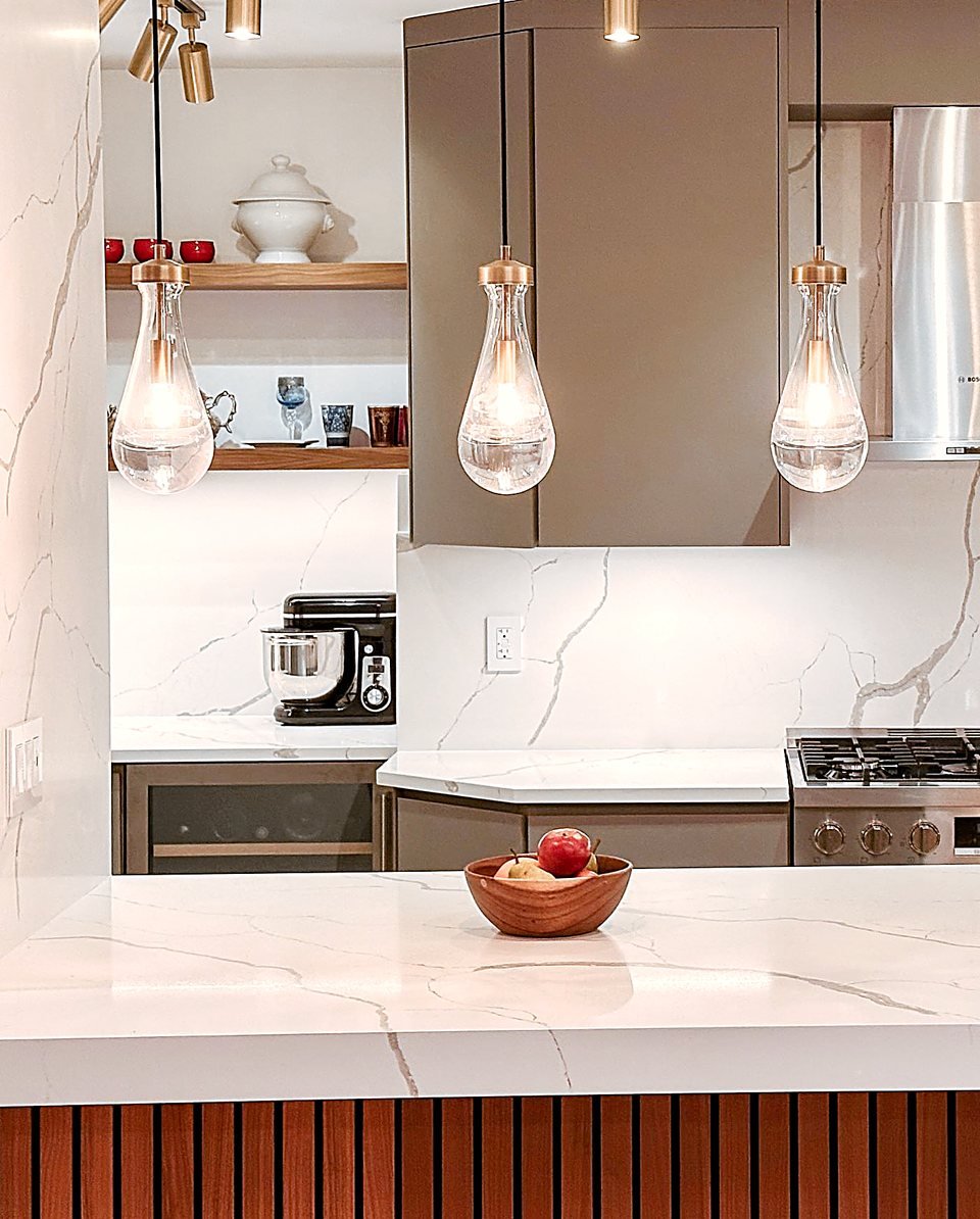 Pendant lights over a marble island